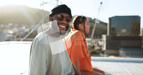 Image of Black couple, smile and portrait on rooftop in city, outdoors and bonding. Diversity, sunglasses and happy man, woman and relax, love and having fun, enjoying view and spending quality time together.