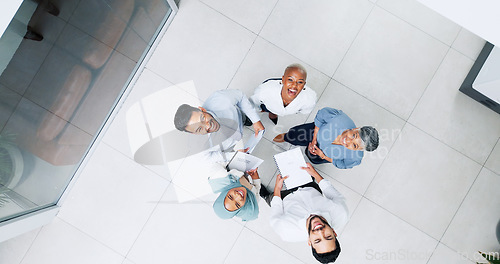 Image of Top view, business and team in lobby, brainstorming and planning for marketing development, sales growth and office. Teamwork, innovation and staff share ideas, conversation and project collaboration