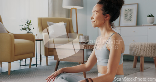 Image of Meditation, pilates and home yoga for black woman working on spiritual chakra peace, freedom of the mind and zen mindset. Body health, wellness lifestyle and relax girl training on living room floor