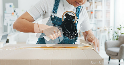 Image of Woman packing box, package and cargo with tape for delivery, sale and shipping in workshop, startup store and creative studio. Female small business owner prepare product, order and service logistics