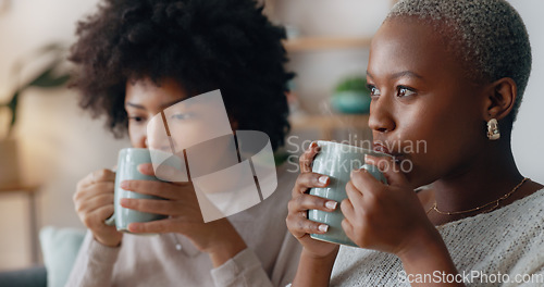 Image of Chocolate drink and black woman friends on sofa talking and having winter celebration. African people or gen z women enjoying sweet milk coffee or cocoa beverage on couch in their apartment lounge