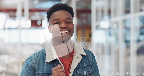 Image of Black man, face and smile portrait in building for designer success, positive mindset and employee standing in lobby. African man, portrait and happy for innovation vision or entrepreneur headshot