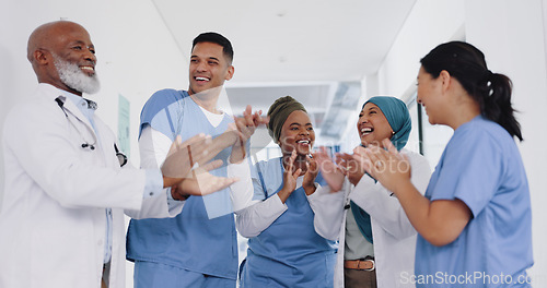 Image of Applause, healthcare teamwork and hospital success, collaboration or motivation. Diversity, happy doctors and nurses clapping hands in commitment, trust and support of medical goals, deal or wellness