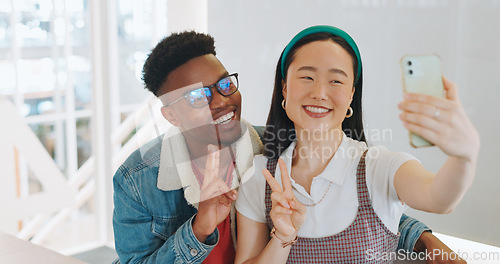 Image of Phone selfie, peace sign and thumbs up of couple taking pictures for happy memory, social media or blog post. Love, diversity and man and woman with hand gesture taking a photo on smartphone at home.