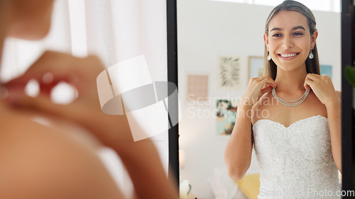 Image of Wedding, jewellery and mirror with bride feeling happy with her wedding dress in room, excited for her dream wedding. Young female looking elegant and classy, ready for marriage ceremony celebration