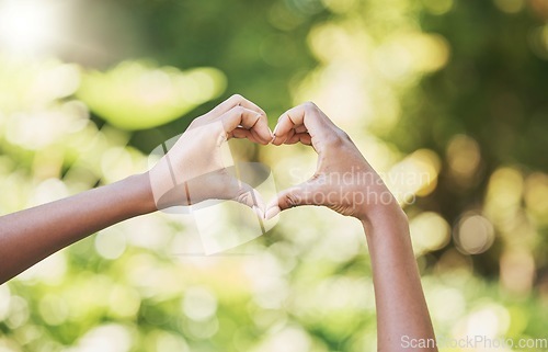 Image of Hands, heart and sign for agriculture love, nature or eco friendly environment in the outdoors. Hand of person showing hearty shape emoji, symbol or icon for natural sustainability, growth or ecology