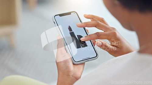 Image of Shopping online and scrolling through makeup products to find a sale or discount. Hands of a woman browsing cosmetics on her phone from above. Enjoying the convenience and ease of purchasing apps