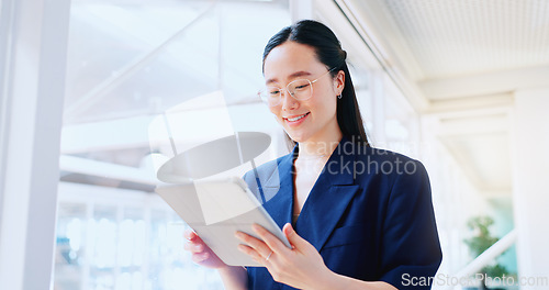 Image of Business woman, tablet and technology, typing email for company communication or digital report. Internet, wifi and ux, networking and Asian employee with smile and inspiration in Japan office