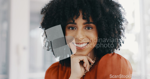 Image of Face, vision and mindset with a business black woman sitting at a desk with her hand on her chin. Portrait, happy and smile with a female employee thinking about future growth or company development