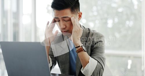 Image of Asian businessman, headache or tired face in communication office, laptop or marketing company. Man, computer and mental health with burnout, target or kpi at digital marketing agency on web in Tokyo