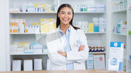 Image of Portrait of a cheerful and friendly pharmacist using a digital tablet to check inventory or online orders in a chemist. Young latino woman using pharma app to do research on medication in a pharmacy