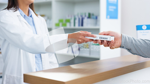 Image of Talking pharmacist explaining medication to patient in clinic pharmacy, sharing trusted knowledge or selling drug recommendation. Medical professional helping or showing customer prescription dosage