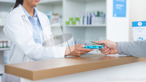 Image of Patient buying medicine from pharmacist at the pharmacy store. Customer receives prescription medication at the chemist store from medical doctor. Healthcare professional accepts credit card payment