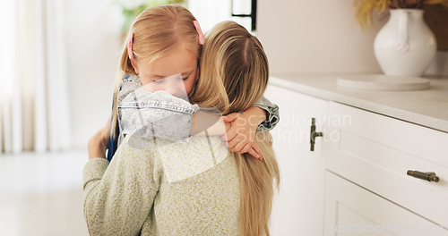 Image of Hug, mother and child with love, care and smile to celebrate mothers day in their house. Young girl hugging her mom for affection, happiness and peace in the living room of their family home