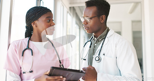 Image of Healthcare tablet, team and planning with doctor and nurse talking, discussion and communication about medicine. Black man and woman hospital staff meeting with technology for innovation and research