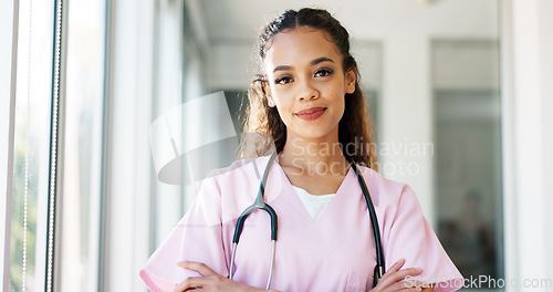 Image of Face, doctor and black woman with smile, healthcare and wellness in hospital, arms crossed and confident. Portrait, African American female and medical professional in uniform, happy and leadership