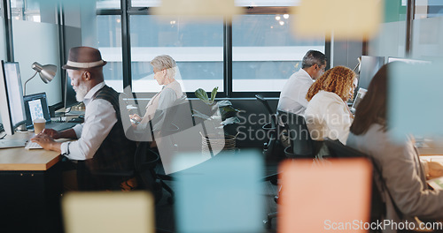 Image of Digital marketing, computer or employees in a digital agency office building with focus, productivity or kpi goals. Website, men and women working on sales growth mission or SEO strategy on internet