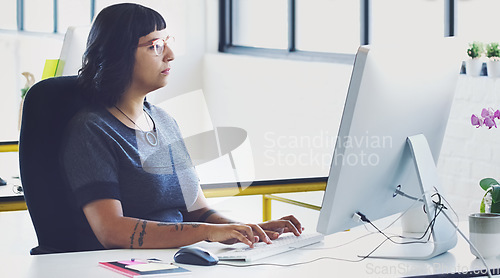 Image of Business, computer for typing and woman planning, focus and online reading for news, email and proposal for advertising campaign. Female employee, leader and manager with pc, thinking and workplace