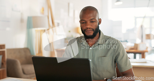 Image of Email, phone and businessman working, planning and in communication with people on the internet at work. African manager, worker or employee typing on a laptop and reading on a mobile in an office