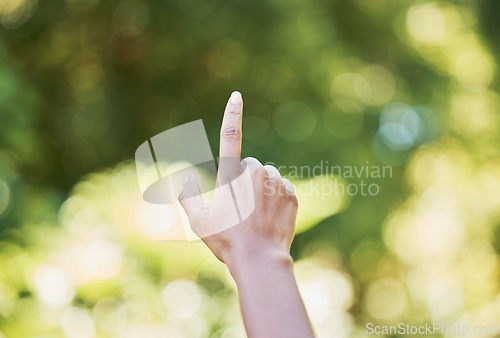 Image of Hand, nature and sustainability with a woman touching a green background for eco friendly conservation. Finger, spring and ecology with a female outdoor in a natural environment to touch mockup