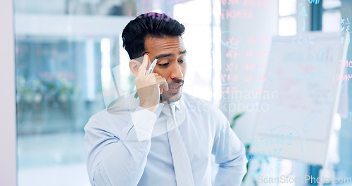 Image of Thinking, strategy and serious businessman writing on glass wall with thoughtful analysis in office. Brainstorming, planning and vision of corporate worker with focus, concentration and idea.