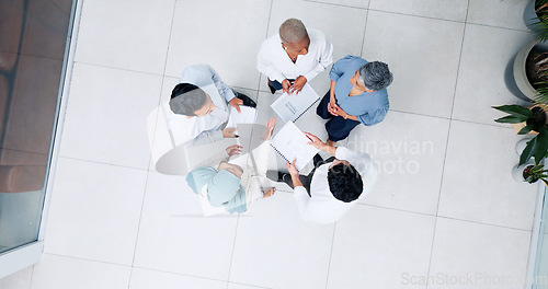 Image of Top view, business and team in lobby, brainstorming and planning for marketing development, sales growth and office. Teamwork, innovation and staff share ideas, conversation and project collaboration
