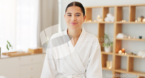 Image of Face, portrait and woman at spa for skincare, luxury massage and wellness on a bed at a hotel. Happy, smile and beauty of a young girl at a salon to relax for peace and calm during cosmetic therapy