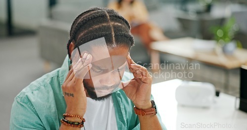 Image of Headache, tired and burnout business man, working on laptop in office with stress, anxiety and burnout. Fatigue, depression and mental health risk of black man employee headache, angry or frustrated