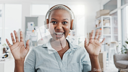 Image of Video call, communication and delivery with a woman courier talking while holding a box or package in her office. Ecommerce, marketing and advertising with a shipping or logistics professional online