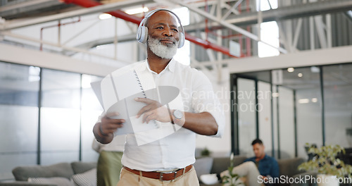 Image of Dance, music and headphones, senior black man at work with energy and positive mindset, happiness and motivation in the workplace. Dancing, radio and fun in workspace, excited for work or retirement.