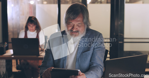 Image of Senior businessman, tablet and night in office for planning, schedule or strategy for digital marketing. Man, woman and late in modern office with laptop, reading or typing for email, success or goal