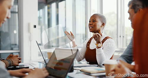 Image of Meeting, discussion and professional black woman talking to her colleagues in the office conference room. Teamwork, presentation and African female employee in conversation with her team for project.