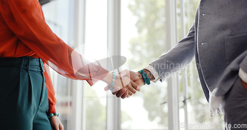 Image of Closeup, handshake and businessman with woman, welcome or respect at meeting, workplace or interview. Business people, greeting and shaking hands in agreement, contract or thank you at finance agency