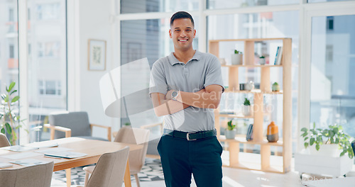 Image of Executive, businessman and arms crossed in office with face, smile or vision for success, goal or happiness. Happy business leader, finance expert or focus on goals, dream or innovation in New York