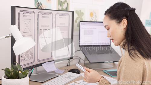 Image of Woman, developer and wireframes with technology in design, planning or strategy at the office. Creative female designer working with layouts by computer for app development or project plan at work