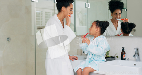 Image of Dental, bathroom and mother and child brushing teeth for oral health, teeth healthcare and cleaning mouth with toothbrush. Black family morning routine, toothpaste and mom teaching self care hygiene