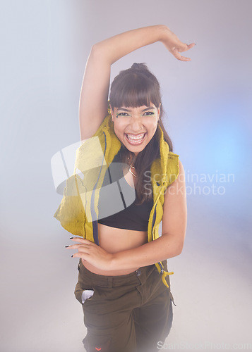 Image of Dance, comic and portrait of a woman with a move isolated on a bokeh studio background. Smile, carefree and dancer dancing with energy, crazy and comedy with confidence and laughing on a backdrop