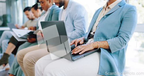 Image of Hands, laptop or waiting and a business woman in line for her hiring interview with human resources. Computer, resume and recruitment with a female candidate sitting in a row for a company vacancy