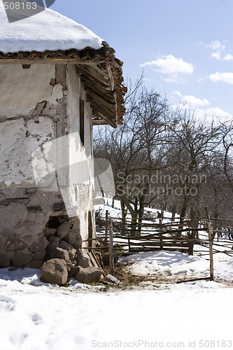 Image of traditional Serbian farm house in winter