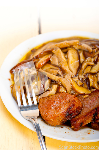 Image of venison deer game filet and wild mushrooms