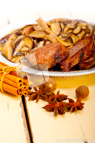 Image of venison deer game filet and wild mushrooms