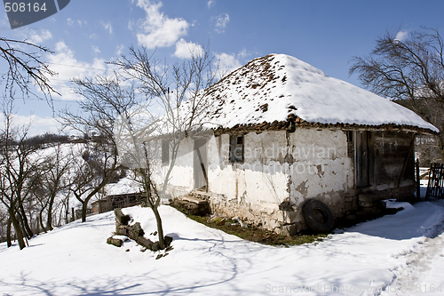 Image of traditional Serbian farm house in winter