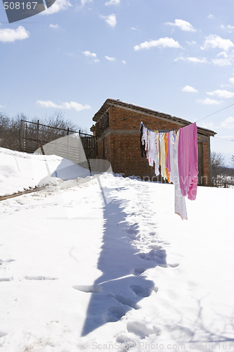 Image of clothes hanging to dry in the snow