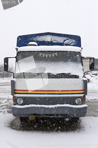 Image of an old truck parked in the snow