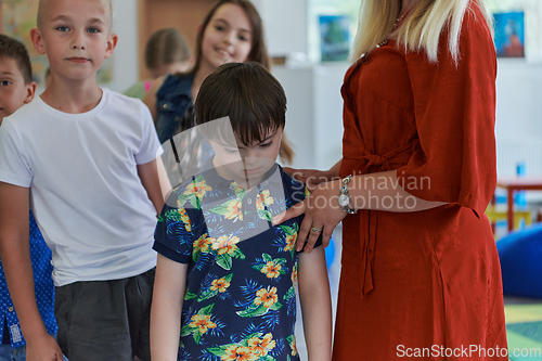 Image of Preschool children wait in line for new and interesting games. Selective focus