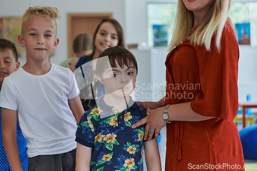 Image of Preschool children wait in line for new and interesting games. Selective focus