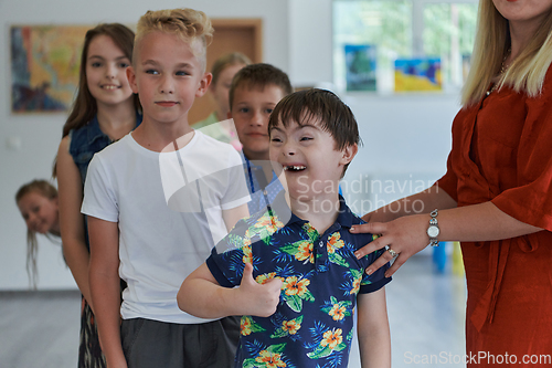 Image of Preschool children wait in line for new and interesting games. Selective focus