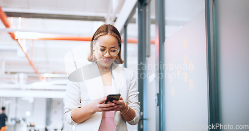 Image of Business woman, office phone and communication of a employee walking with a smile. Corporate worker on technology for social media, web and internet scroll at work with happy texting on a break