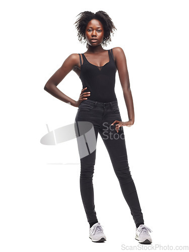 Image of Fashion, portrait and African girl model in a studio with a casual outfit, confidence and natural pose. Beauty, young and proud black woman with an afro posing while isolated by a white background.