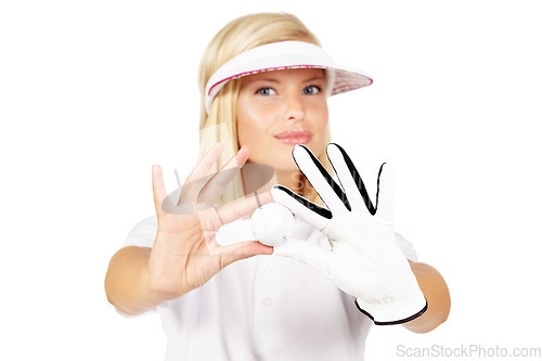 Image of Portrait, golf ball and white background of woman in studio with glove hands, sports uniform and face. Young female golfer showing equipment for games, action and hobby with skill, playing or golfing